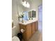 Bathroom with marble countertop, modern fixtures, and a large mirror at 2575 Evening Twilight Ave, Henderson, NV 89044