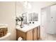 Well-lit bathroom with a marble countertop vanity at 2575 Evening Twilight Ave, Henderson, NV 89044