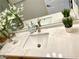 Close up of marble vanity with stylish sink and chrome faucet at 2575 Evening Twilight Ave, Henderson, NV 89044