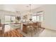 Bright dining room with wood table setting and sliding glass doors to the backyard at 2575 Evening Twilight Ave, Henderson, NV 89044
