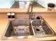 Modern kitchen sink with stainless steel fixtures and ample counter space at 2575 Evening Twilight Ave, Henderson, NV 89044