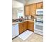 Kitchen with light cabinets, modern appliances, and tile floors at 2575 Evening Twilight Ave, Henderson, NV 89044