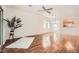 Spacious living room with wood floors, view of the kitchen and backyard access at 2575 Evening Twilight Ave, Henderson, NV 89044