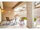 Outdoor patio area with seating and stucco walls at 2575 Evening Twilight Ave, Henderson, NV 89044