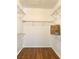 Spacious walk-in closet with wood flooring and wire shelving at 2575 Evening Twilight Ave, Henderson, NV 89044
