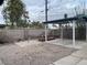 Spacious backyard with a carport and cacti at 3100 Sequoia Ave, Las Vegas, NV 89101