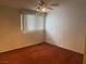 Cozy bedroom with plush carpeting and a ceiling fan at 3100 Sequoia Ave, Las Vegas, NV 89101