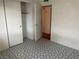 Bedroom features a closet, patterned floor, and open door at 3100 Sequoia Ave, Las Vegas, NV 89101