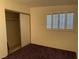 Bright bedroom featuring a closet and shuttered window at 3100 Sequoia Ave, Las Vegas, NV 89101