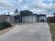 Exterior view of a single-story home showing a carport and a cracked driveway at 3100 Sequoia Ave, Las Vegas, NV 89101