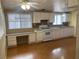 Bright kitchen with white cabinets, a desk area, and matching appliances at 3100 Sequoia Ave, Las Vegas, NV 89101
