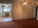 Spacious living room featuring a ceiling fan and a glimpse into another room at 3100 Sequoia Ave, Las Vegas, NV 89101