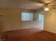 Living room featuring carpet and a ceiling fan for added comfort at 3100 Sequoia Ave, Las Vegas, NV 89101