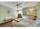 Bedroom with fan, natural light, and wood-look flooring at 3125 N Buffalo Dr # 1105, Las Vegas, NV 89128