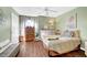 Cozy bedroom with warm wood flooring, soft lighting, and a calm ambiance for relaxation at 3125 N Buffalo Dr # 1105, Las Vegas, NV 89128