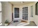 Exterior shot of entrance featuring two doors, window, landscaping and 'Welcome' sign at 3125 N Buffalo Dr # 1105, Las Vegas, NV 89128
