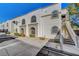 Exterior shot of building featuring unique arched windows, stairs, and stucco facade at 3125 N Buffalo Dr # 1105, Las Vegas, NV 89128