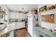Well-lit kitchen featuring white cabinets, granite countertops, and stainless steel appliances at 3125 N Buffalo Dr # 1105, Las Vegas, NV 89128