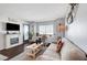 Cozy living room with a fireplace, plush seating, and a window seat at 3125 N Buffalo Dr # 1105, Las Vegas, NV 89128