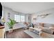 Inviting living room with hardwood floors, comfortable seating, and ample natural light at 3125 N Buffalo Dr # 1105, Las Vegas, NV 89128