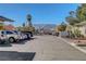 Exterior view of a parking lot near condos with mountain views in the background at 3125 N Buffalo Dr # 1105, Las Vegas, NV 89128
