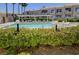 Inviting community pool surrounded by lush greenery, providing a serene and private escape at 3125 N Buffalo Dr # 1105, Las Vegas, NV 89128