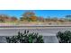 Scenic view from the property overlooking a park, street, and lush greenery at 3125 N Buffalo Dr # 1105, Las Vegas, NV 89128