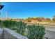 Scenic view from the property overlooking a park, street, and lush greenery at 3125 N Buffalo Dr # 1105, Las Vegas, NV 89128