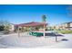 Inviting community space featuring shaded picnic tables and barbecue grill under a clear blue sky at 320 San Antonio River St, North Las Vegas, NV 89084