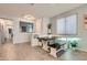 Bright dining area with modern seating, seamlessly connected to the living spaces at 320 San Antonio River St, North Las Vegas, NV 89084