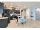 Modern kitchen with stainless steel appliances, granite countertops, and a stylish breakfast bar at 320 San Antonio River St, North Las Vegas, NV 89084