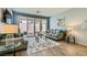 Comfortable living room with modern furnishings and a view of the outdoor space through sliding doors at 320 San Antonio River St, North Las Vegas, NV 89084