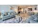 Bright and airy living room with an open concept layout and access to the kitchen and dining area at 320 San Antonio River St, North Las Vegas, NV 89084