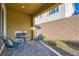 Charming outdoor patio with pavers, a cozy fireplace and relaxing seating at 320 San Antonio River St, North Las Vegas, NV 89084