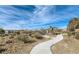 Picturesque community walking path lined with desert landscaping, perfect for leisurely strolls at 320 San Antonio River St, North Las Vegas, NV 89084