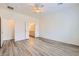 Spacious bedroom with gray tone flooring and view of an en-suite bathroom at 3220 Flinthead Dr, North Las Vegas, NV 89084