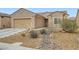 Charming single-story home with desert landscaping, rock accents, and a two-car garage at 3220 Flinthead Dr, North Las Vegas, NV 89084