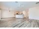 Open-concept living area flows into a modern kitchen with stainless steel appliances at 3220 Flinthead Dr, North Las Vegas, NV 89084