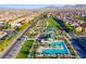 Aerial view of community park featuring a pool, tennis courts, baseball fields, and green spaces at 3243 Fountaintree Ave, Henderson, NV 89044