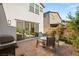 Private patio with a grill and access to the interior through large sliding glass doors at 3243 Fountaintree Ave, Henderson, NV 89044