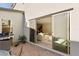 Outdoor patio with grill and easy access to the living area through sliding glass doors at 3243 Fountaintree Ave, Henderson, NV 89044