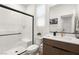 Modern bathroom featuring a sleek glass shower, vanity with ample storage, and contemporary fixtures at 3243 Fountaintree Ave, Henderson, NV 89044