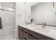 Elegant bathroom featuring double vanity, framed mirrors, and a shower-tub combo at 3243 Fountaintree Ave, Henderson, NV 89044