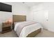 Bright bedroom with light wood accents, modern furniture, and a closet with sliding doors at 3243 Fountaintree Ave, Henderson, NV 89044