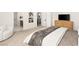 Cozy bedroom featuring a king-sized bed, sitting area, and contemporary design at 3243 Fountaintree Ave, Henderson, NV 89044