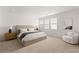 Spacious primary bedroom showcasing a king bed, plush carpet, and contemporary decor at 3243 Fountaintree Ave, Henderson, NV 89044
