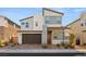 Charming two-story home with a modern design and well-maintained landscaping at 3243 Fountaintree Ave, Henderson, NV 89044