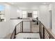 Modern loft area featuring railing, natural light, and desk area at 3243 Fountaintree Ave, Henderson, NV 89044
