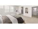 Comfortable main bedroom with a bed, ensuite bathroom, and modern decor at 3243 Fountaintree Ave, Henderson, NV 89044