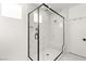 Stylish glass-enclosed shower featuring modern fixtures and marble-style tile at 3243 Fountaintree Ave, Henderson, NV 89044